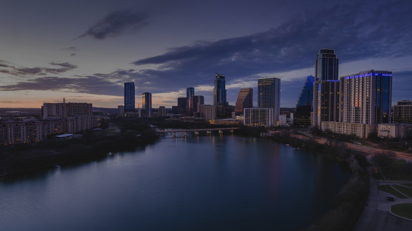 Lady Bird Lake Austin skyline twilight panorama with downtown reflections.